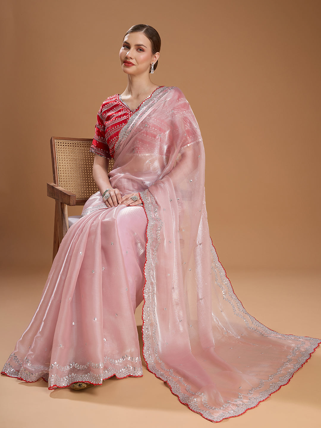 Elegant pink saree with red designer blouse
