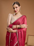 Elegant pink saree with sleeveless blouse for festive occasions