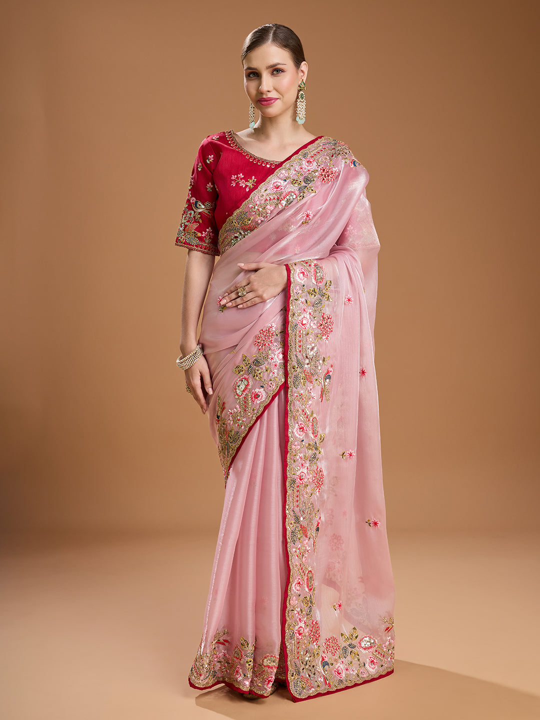 Baby pink Jimmy Choo saree with red blouse