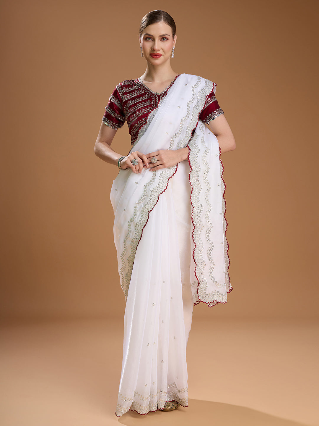 White embroidered saree with maroon blouse