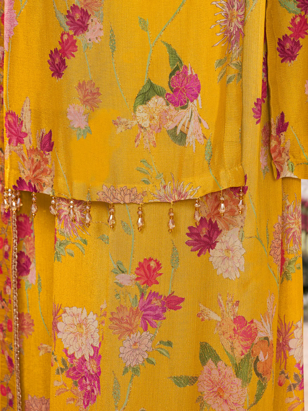 Mustard yellow chinon sharara suit with matching dupatta and tassels

