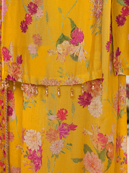 Mustard yellow chinon sharara suit with matching dupatta and tassels

