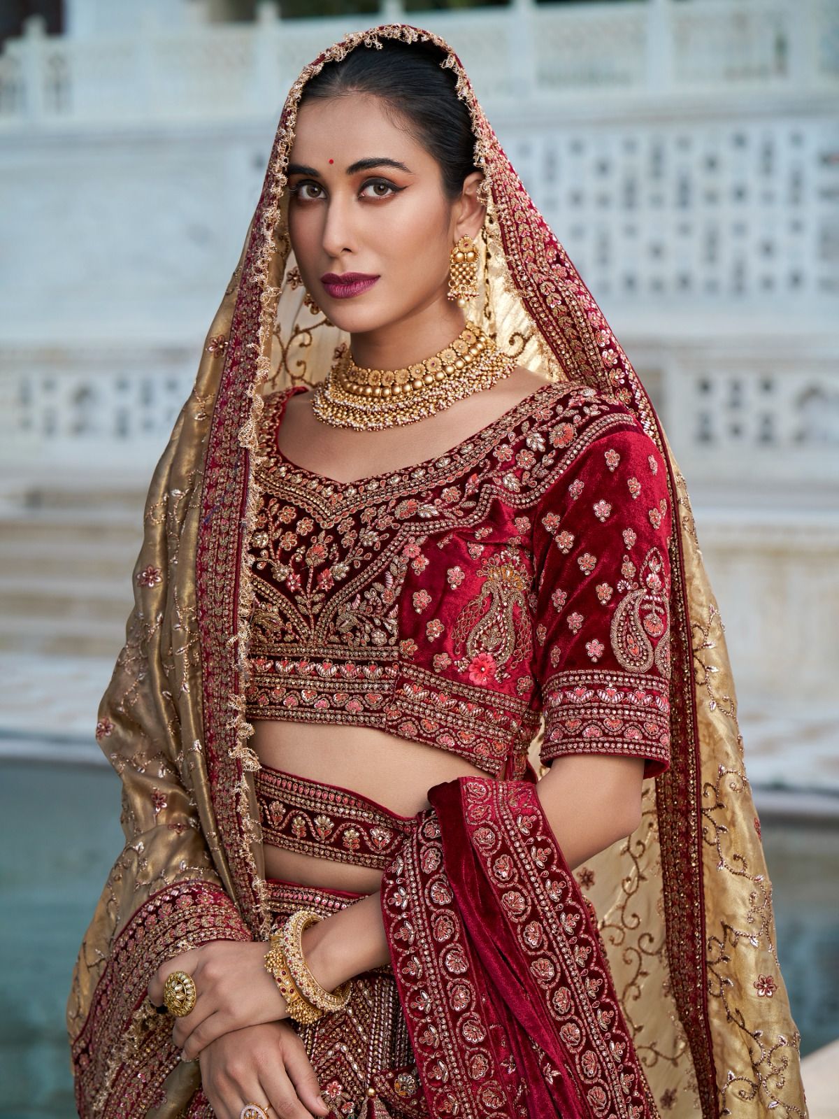 Maroon and Gold Bridal Lehenga with Handcrafted Embroidery