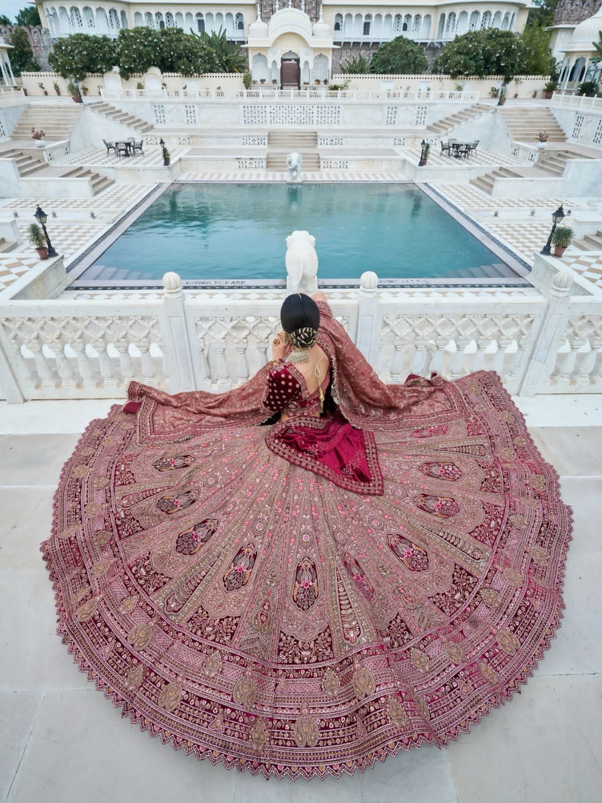 Elegant maroon and beige bridal lehenga choli with intricate embroidery.

