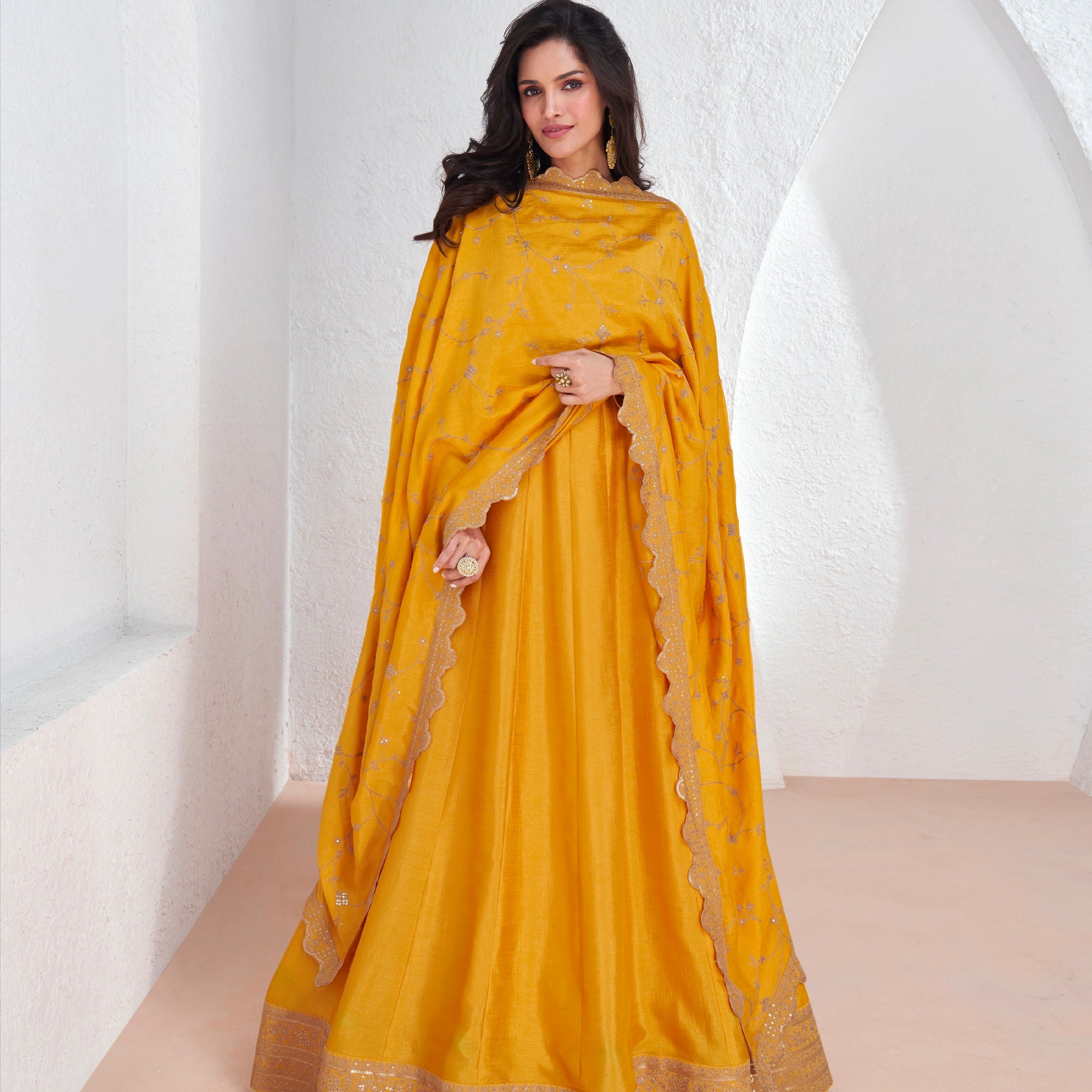 Mustard yellow embroidered premium silk Anarkali suit with dupatta for weddings and festivals.