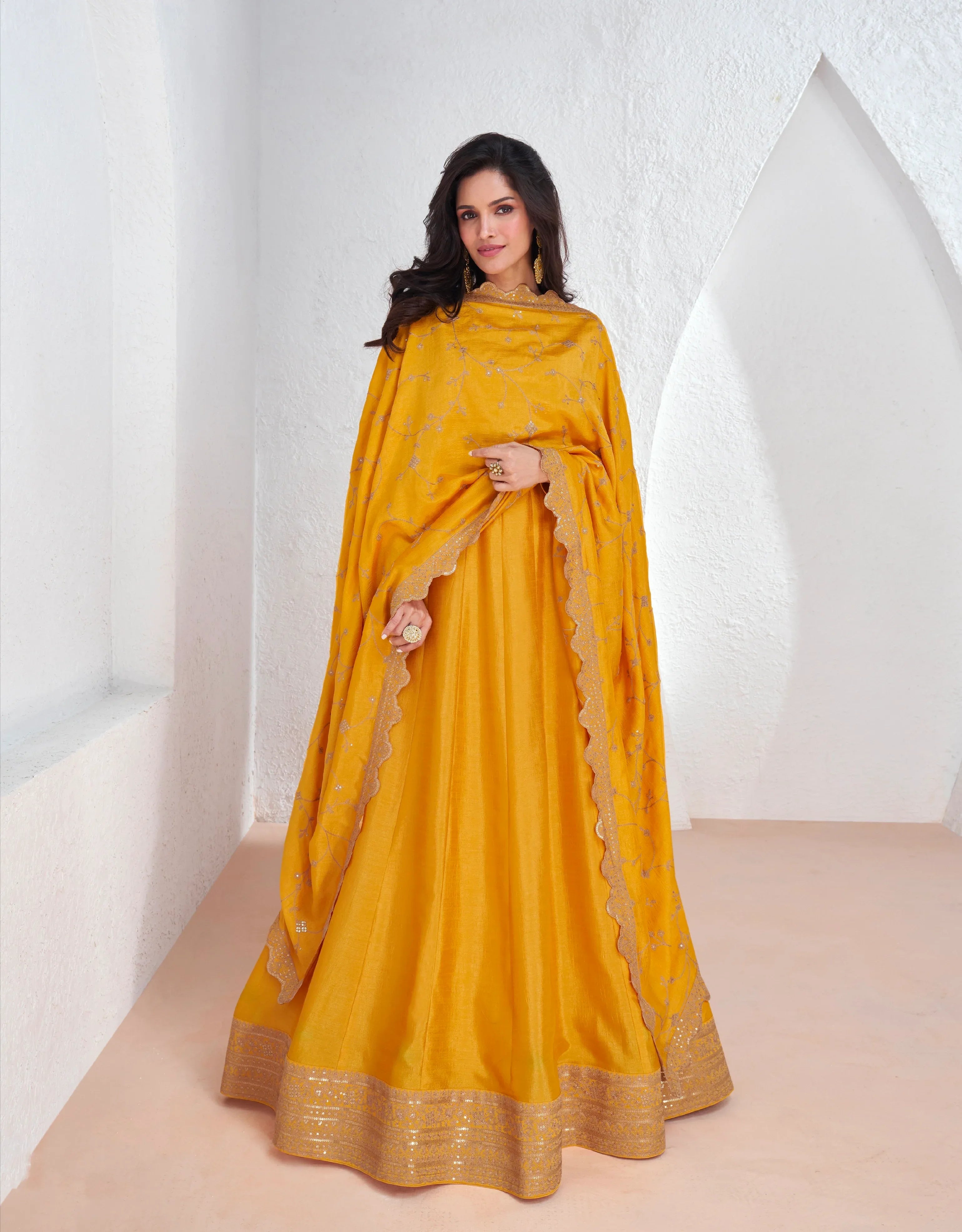 Mustard yellow embroidered premium silk Anarkali suit with dupatta for weddings and festivals.