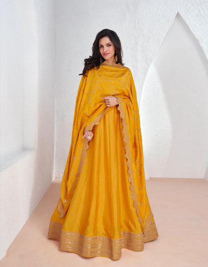 Mustard yellow embroidered premium silk Anarkali suit with dupatta for weddings and festivals.