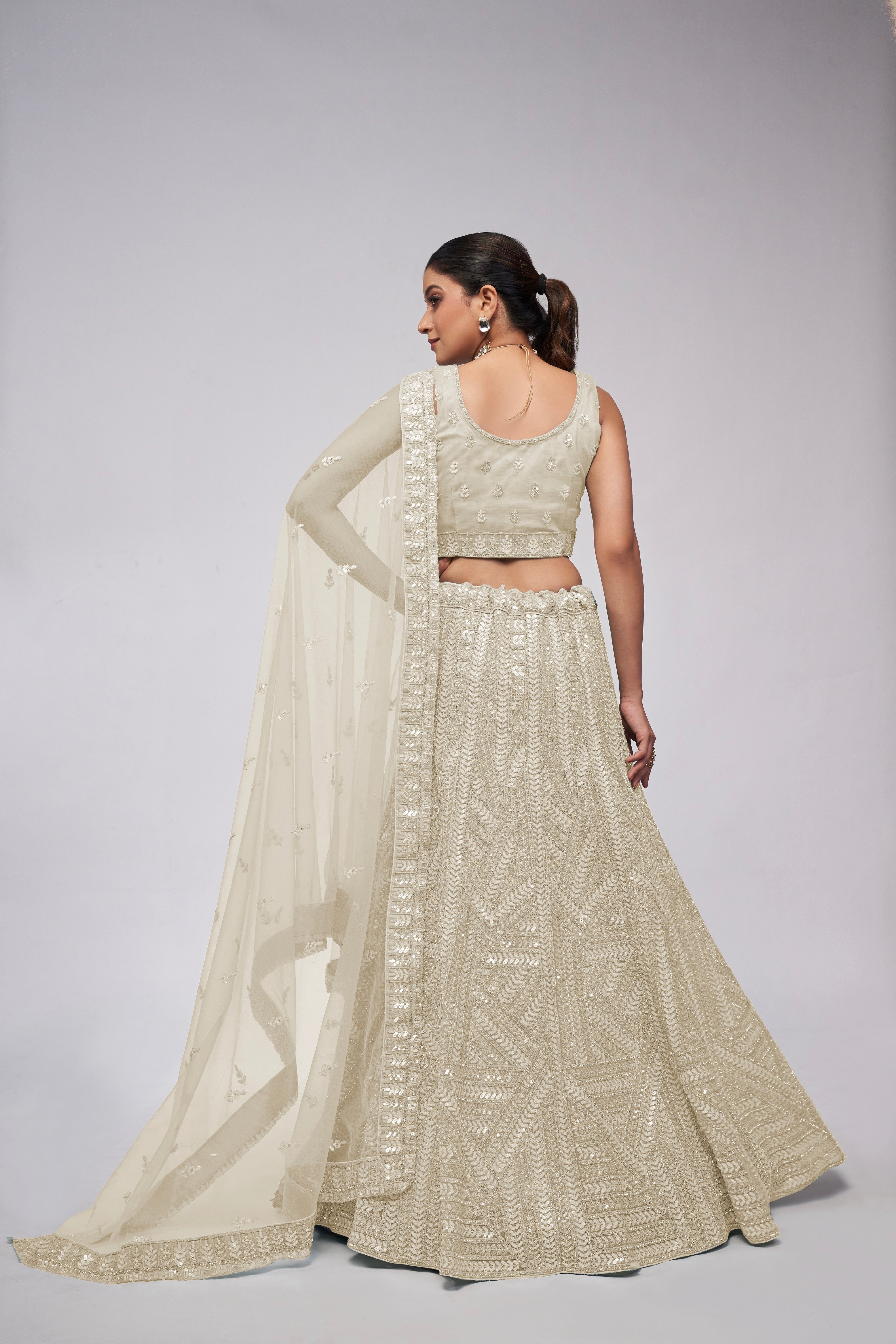 Elegant Ivory Lehenga with Sequins Work and Matching Dupatta