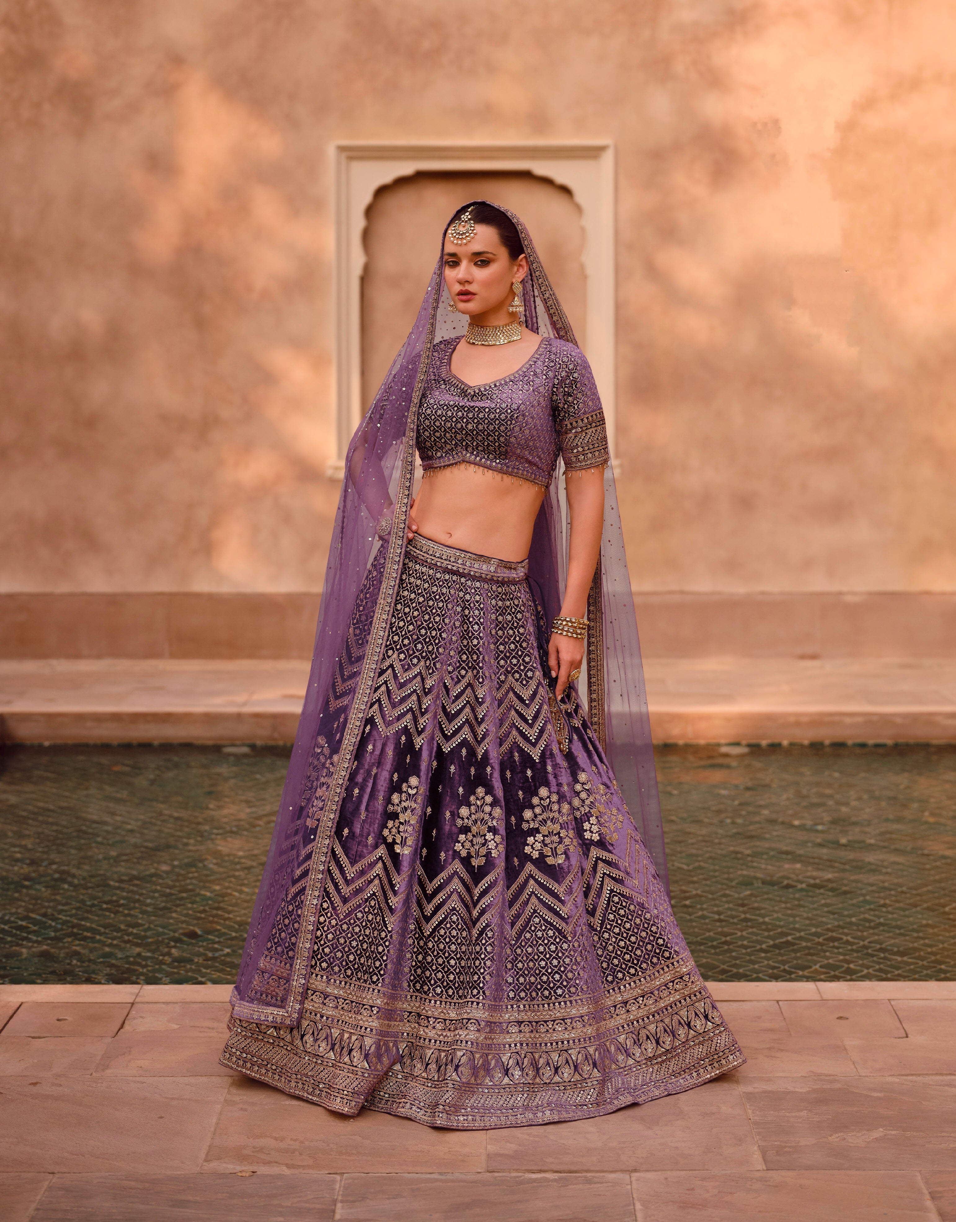 Purple Bridal Lehenga in Pure Silk with Handwork Blouse and Embroidered Dupatta.
