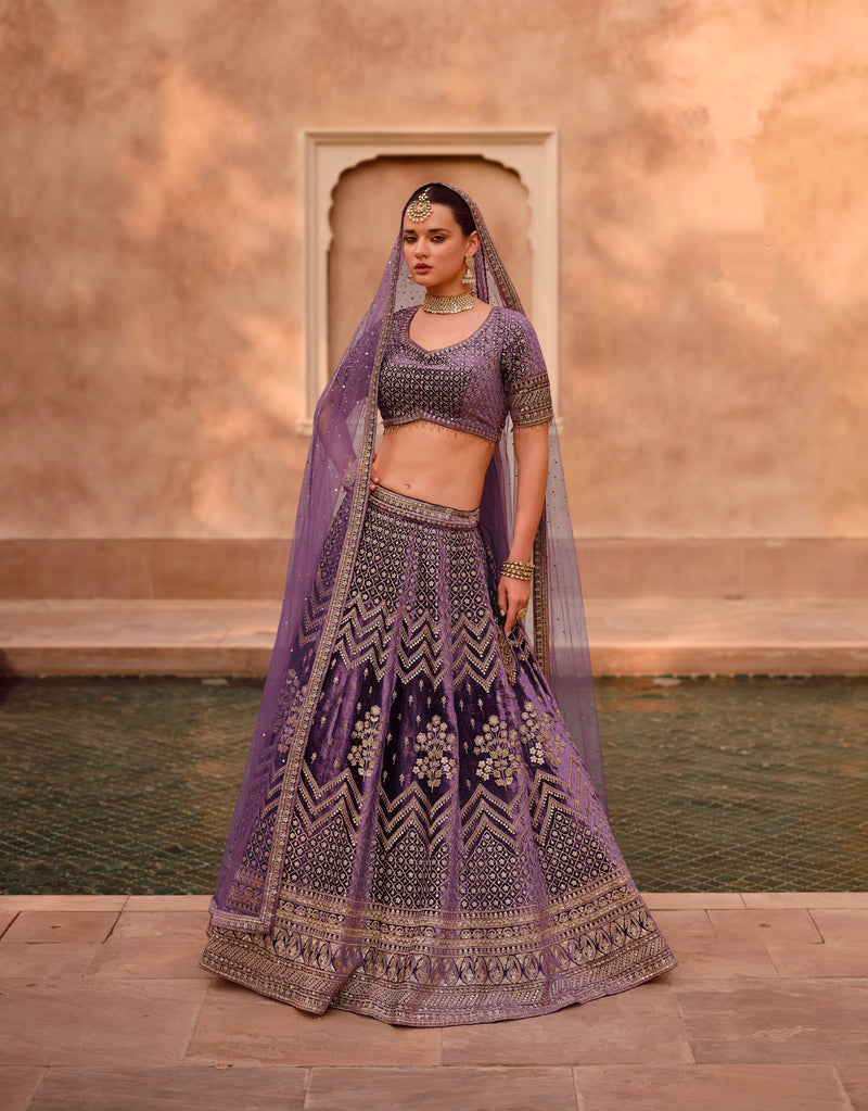Purple Bridal Lehenga in Pure Silk with Handwork Blouse and Embroidered Dupatta.