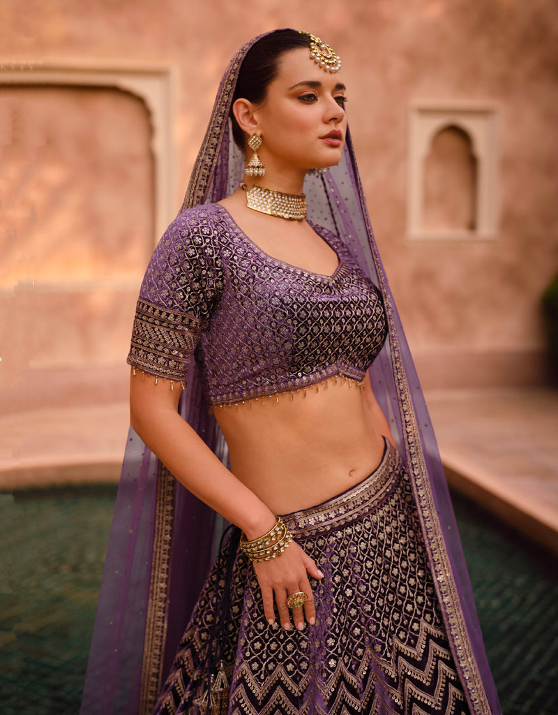 Purple Bridal Lehenga in Pure Silk with Handwork Blouse and Embroidered Dupatta.