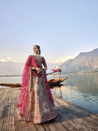 Elegant gold silk bridal lehenga with maroon embroidered blouse and dupatta.