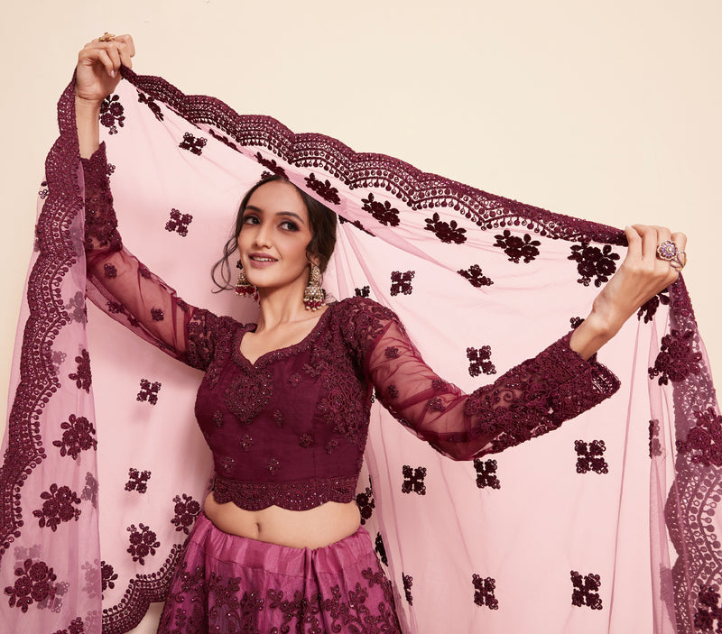 Rich Wine Net Lehenga Choli Set with Heavy Stone Work Embellishment