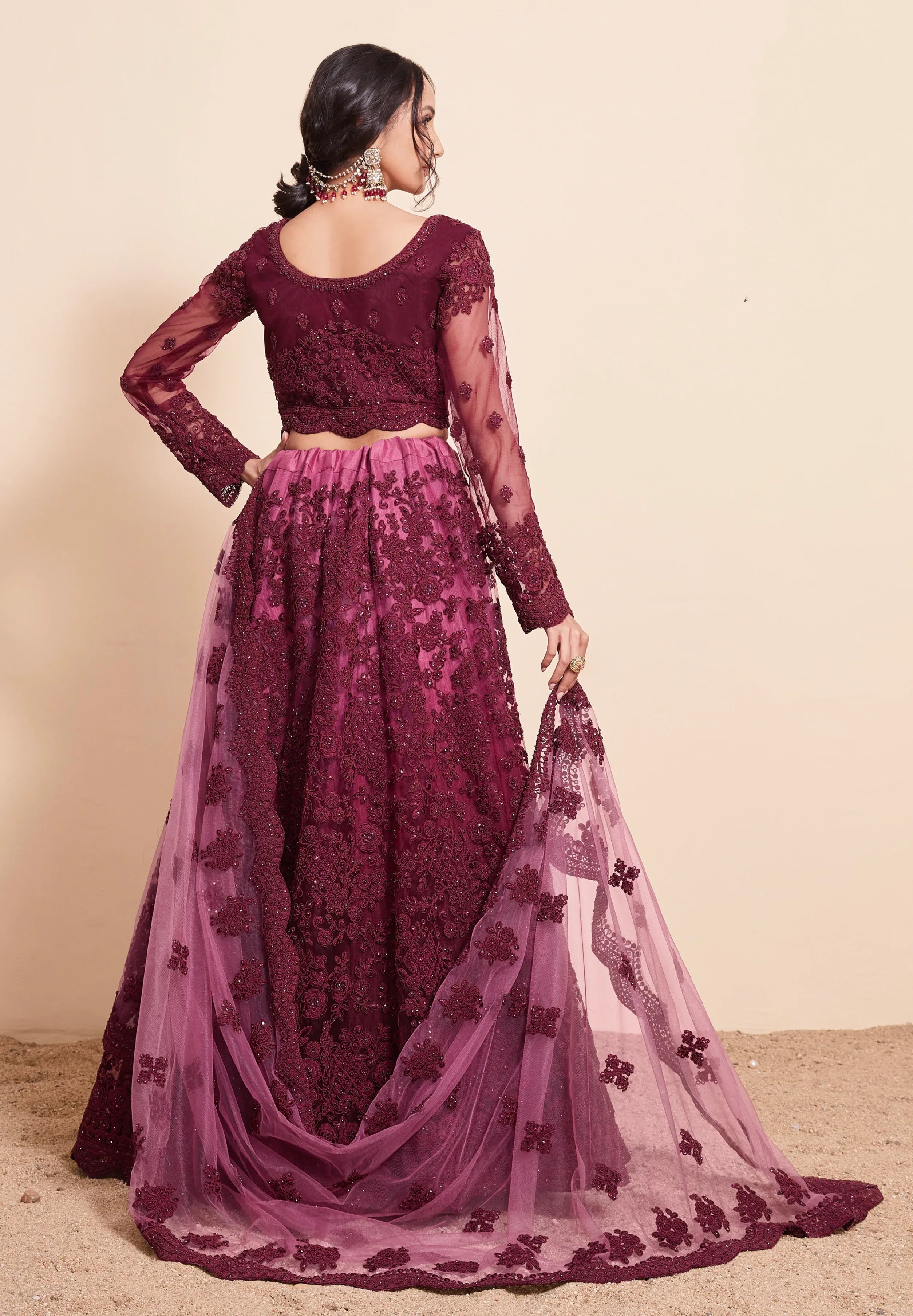 Rich Wine Net Lehenga Choli Set with Heavy Stone Work Embellishment
