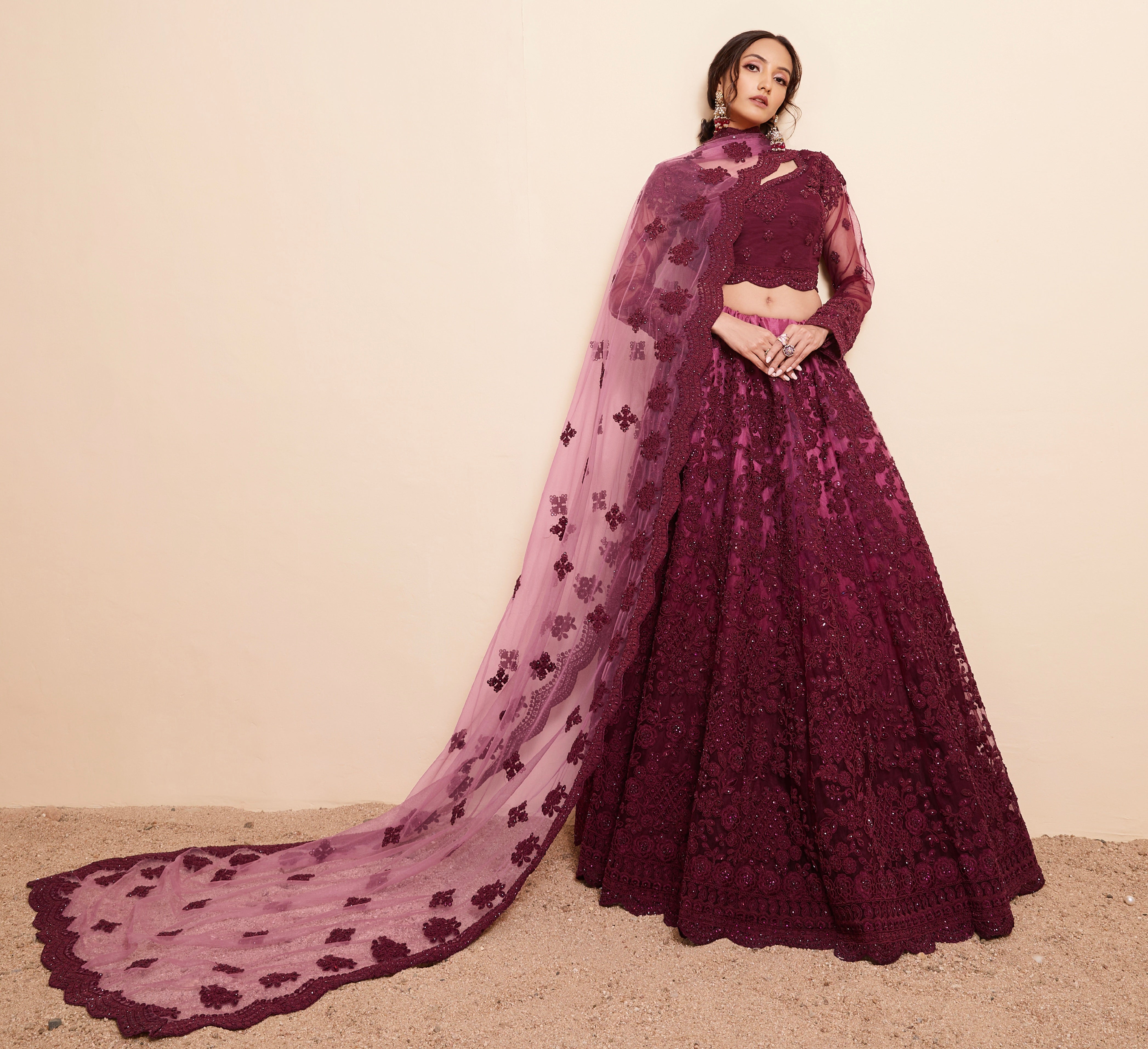Rich Wine Net Lehenga Choli Set with Heavy Stone Work Embellishment