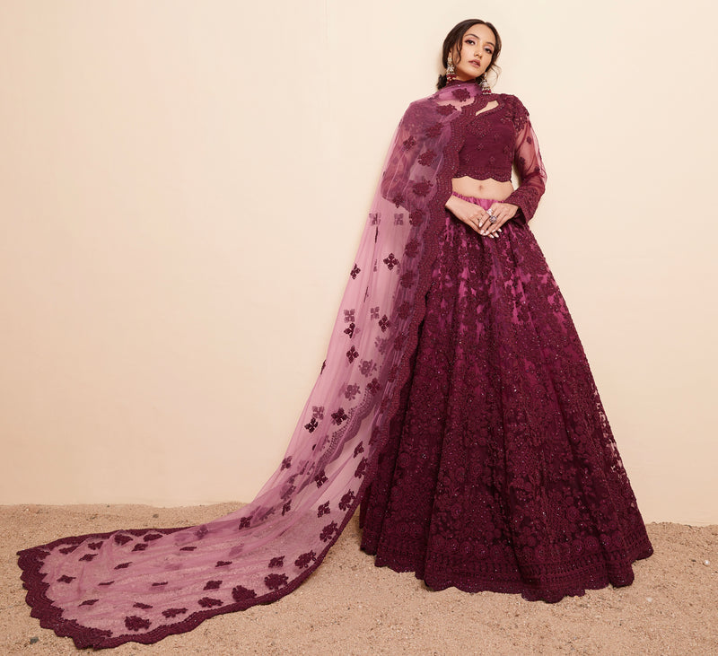 Rich Wine Net Lehenga Choli Set with Heavy Stone Work Embellishment