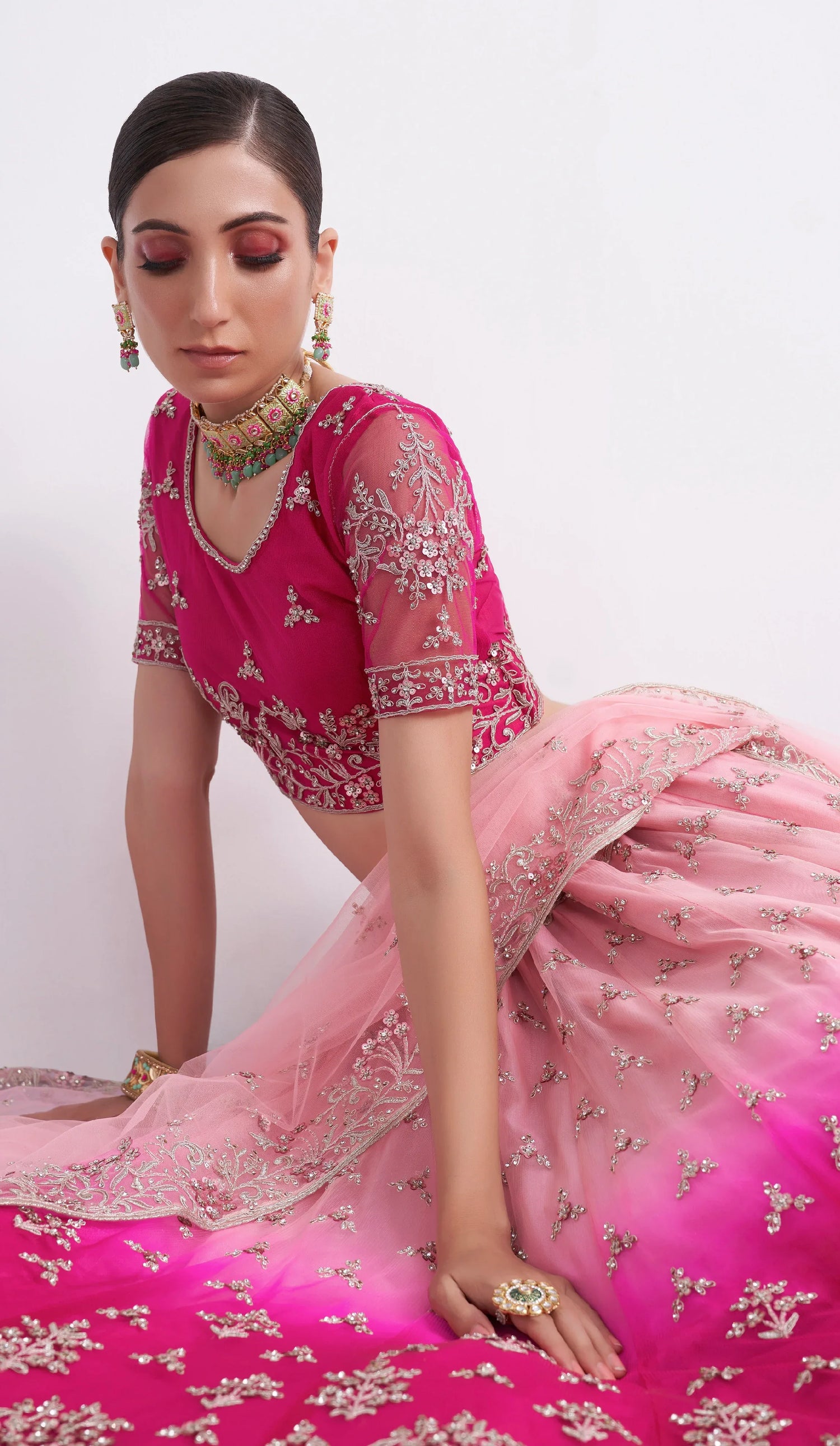 Elegant shaded pink net blouse &amp; lehenga set with silk inner and net dupatta.