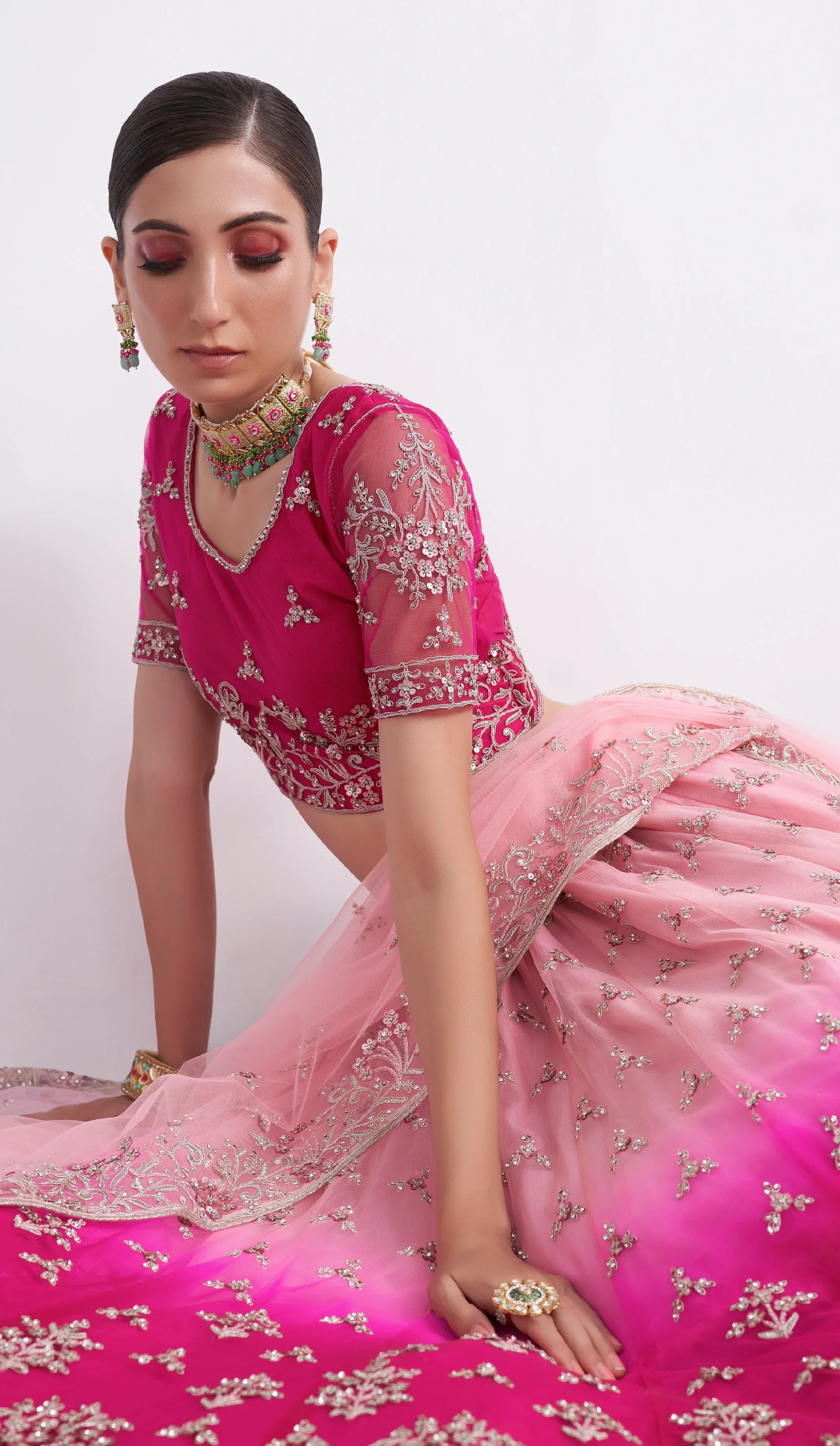 Elegant shaded pink net blouse &amp; lehenga set with silk inner and net dupatta.