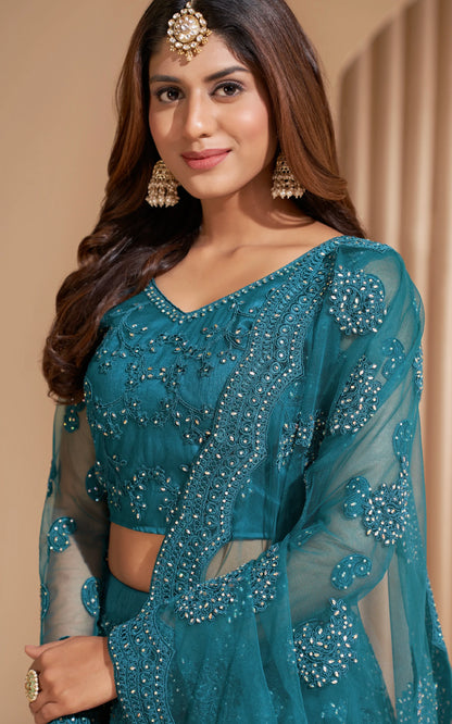 Elegant teal net lehenga with silk inner and thread &amp; cording embroidery.
