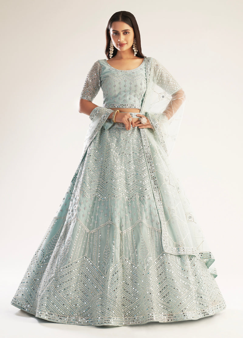 Elegant pastel ocean blue bridal lehenga with ribbon gota work and heavy zarkan embellishments.