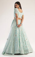 Elegant sea green bridal lehenga with heavy thread, zari embroidery, zarkan, and mirror work.