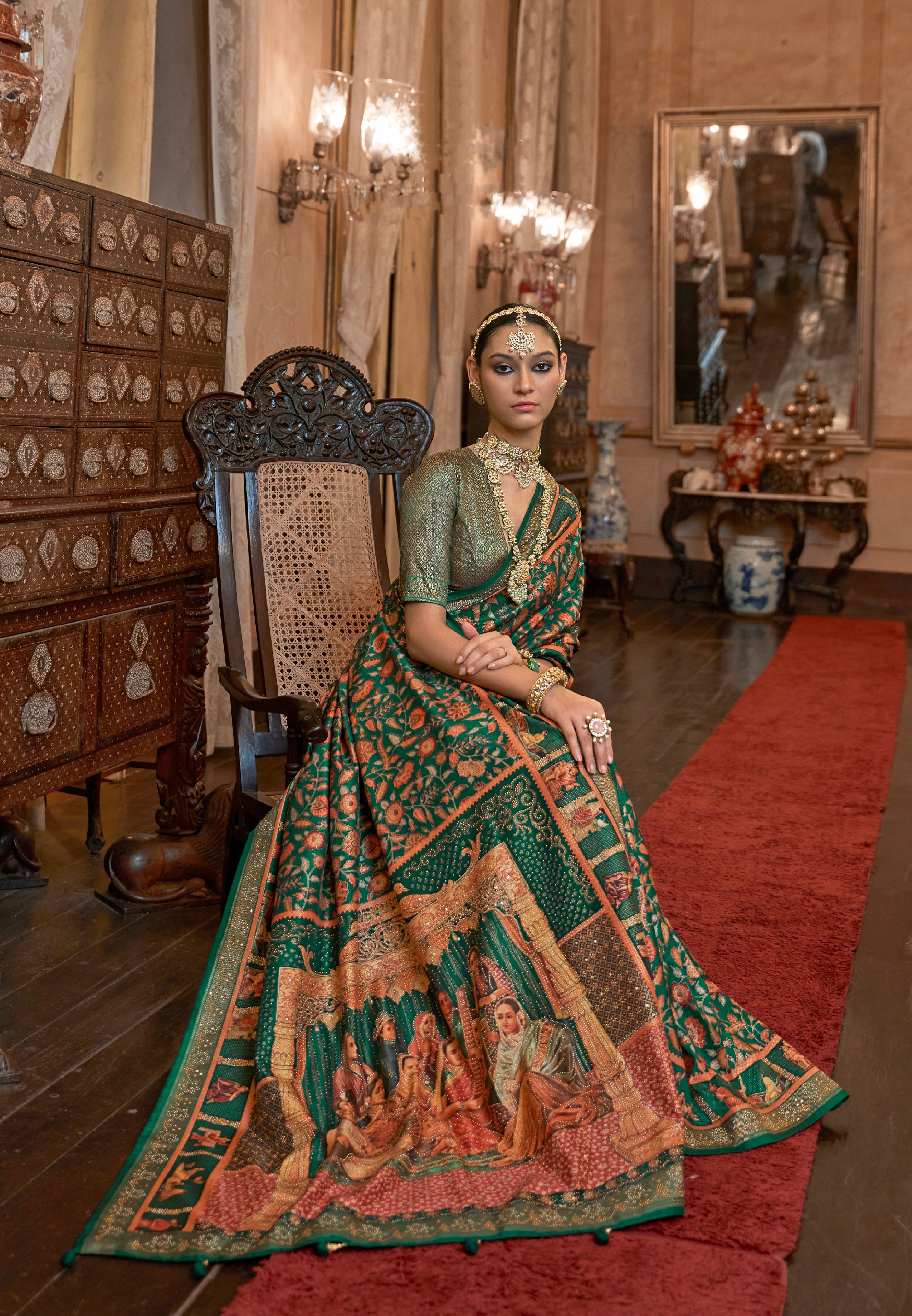 Green Patola Silk Saree with Traditional Motifs and Handmade Tassels