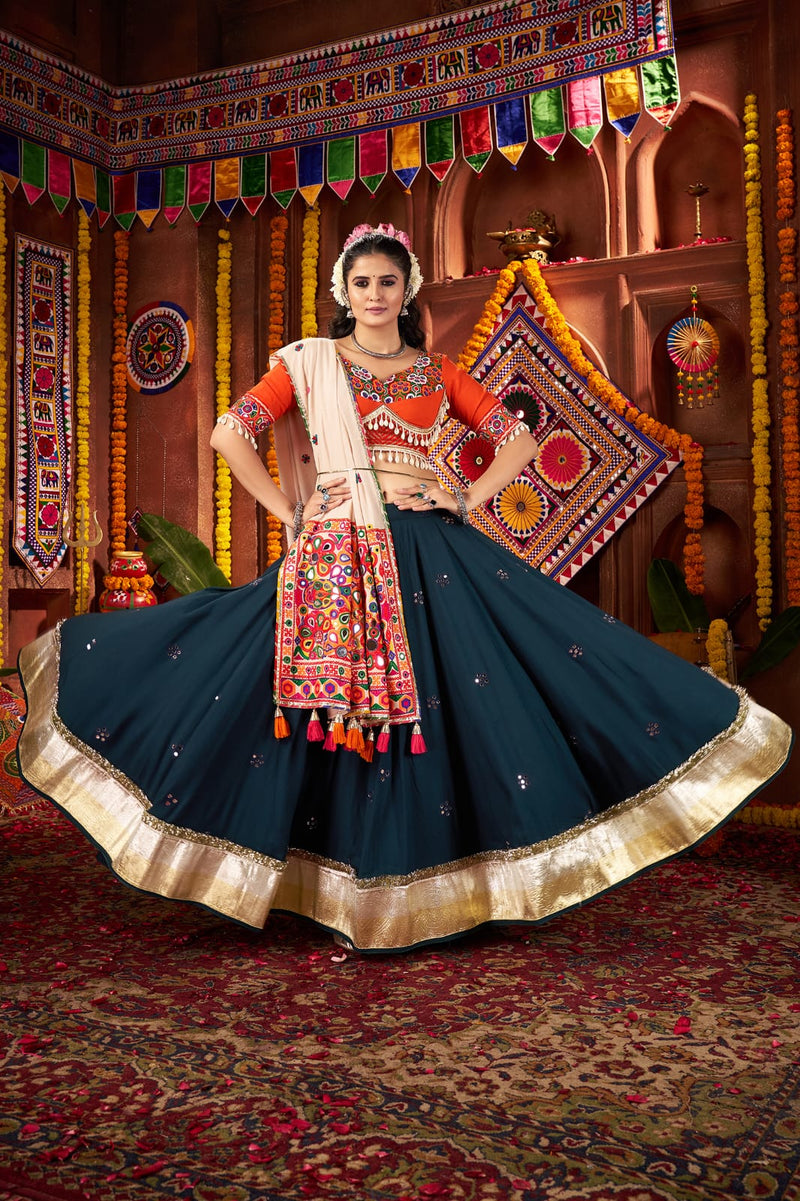 Traditional navratri lehenga in teal blue with kutchi design