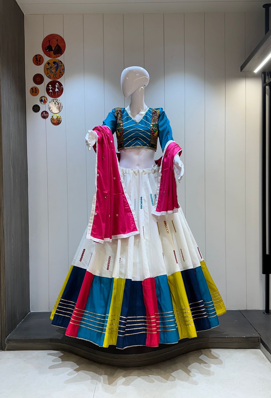 White chaniya choli with blue blouse and pink dupatta