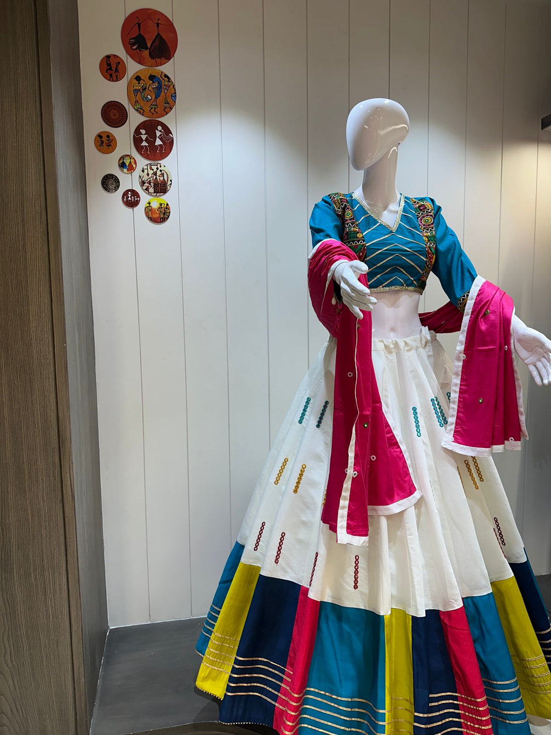 White chaniya choli with blue blouse and pink dupatta