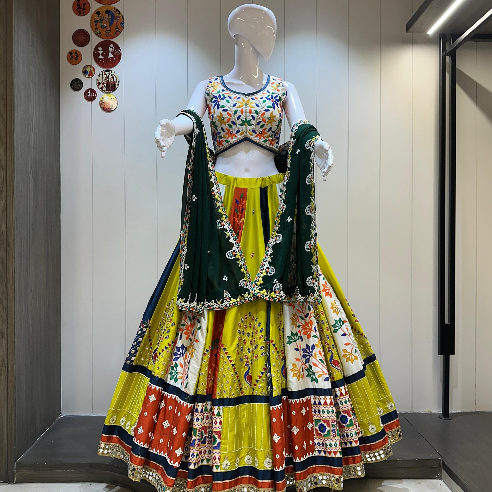 Traditional Navratri wear yellow chaniya choli with green dupatta 