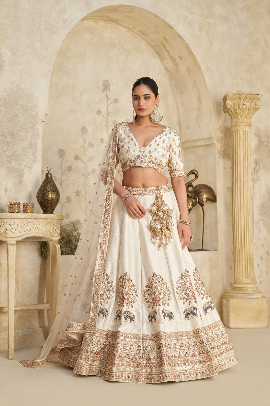 Ivory Royal Silk Lehenga with Elephant Zari Embroidery Silk lehenga Anant Tex Exports Pvt.Ltd..