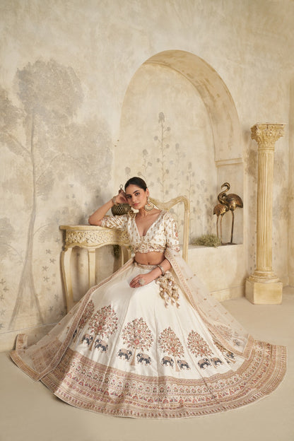 Ivory Royal Silk Lehenga with Elephant Zari Embroidery Silk lehenga Anant Tex Exports Pvt.Ltd..