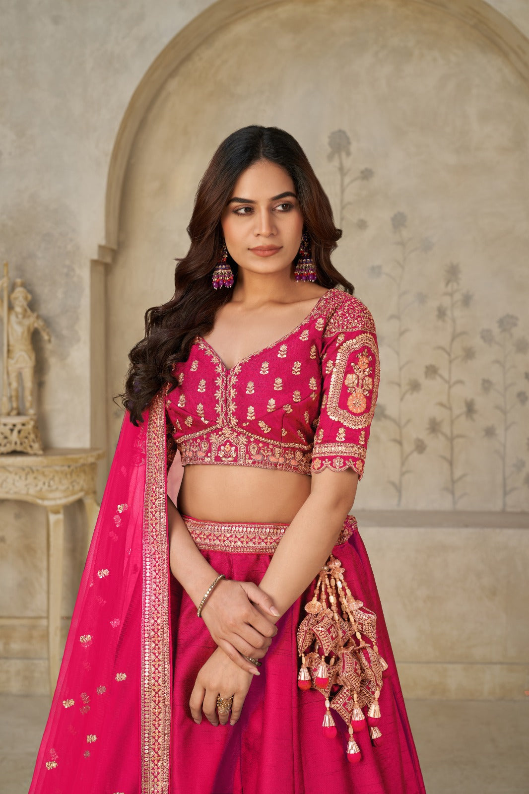 Rani Pink Silk Lehenga with Golden Elephant Embroidery Silk lehenga Anant Tex Exports Pvt.Ltd..