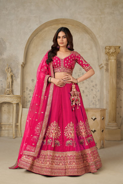 Rani Pink Silk Lehenga with Golden Elephant Embroidery Silk lehenga Anant Tex Exports Pvt.Ltd..