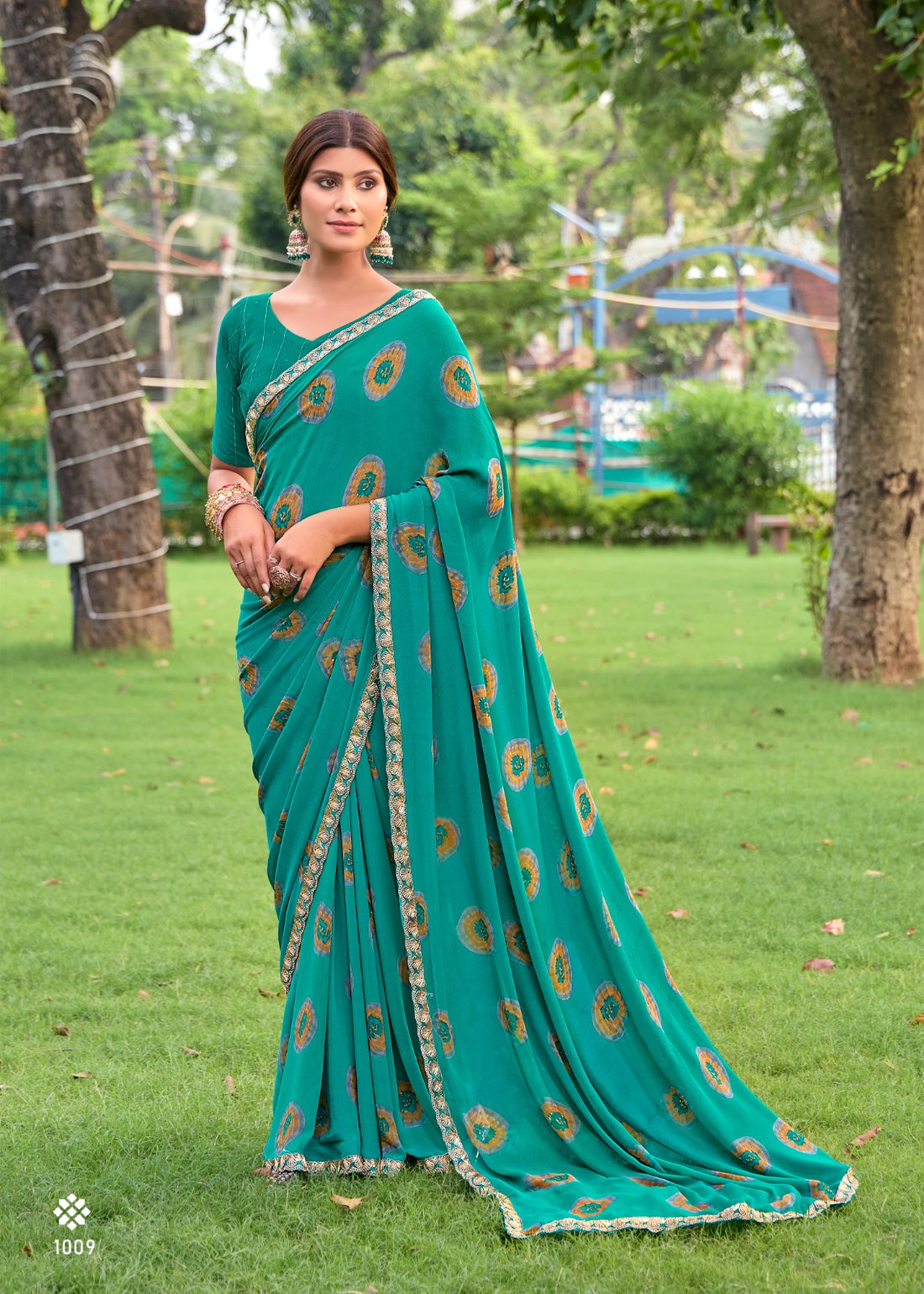 Teal Blue Soft Heavy Weightless Printed Saree Georgette Saree Anant Tex Exports Pvt.Ltd..