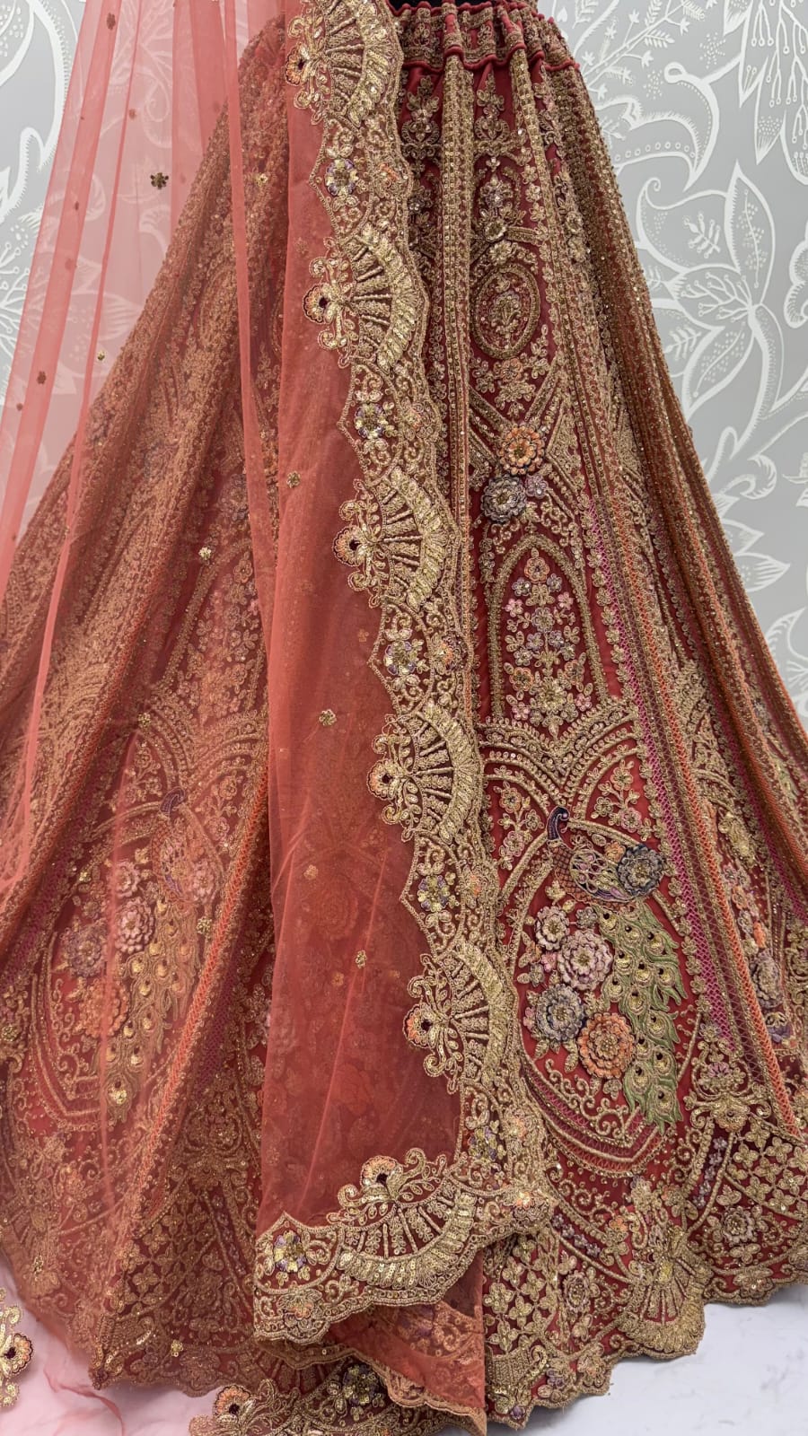 Peach Pure Heavy Net Peacock Pattern Multi Thread Sequins Work Net Bridal Lehenga Choli