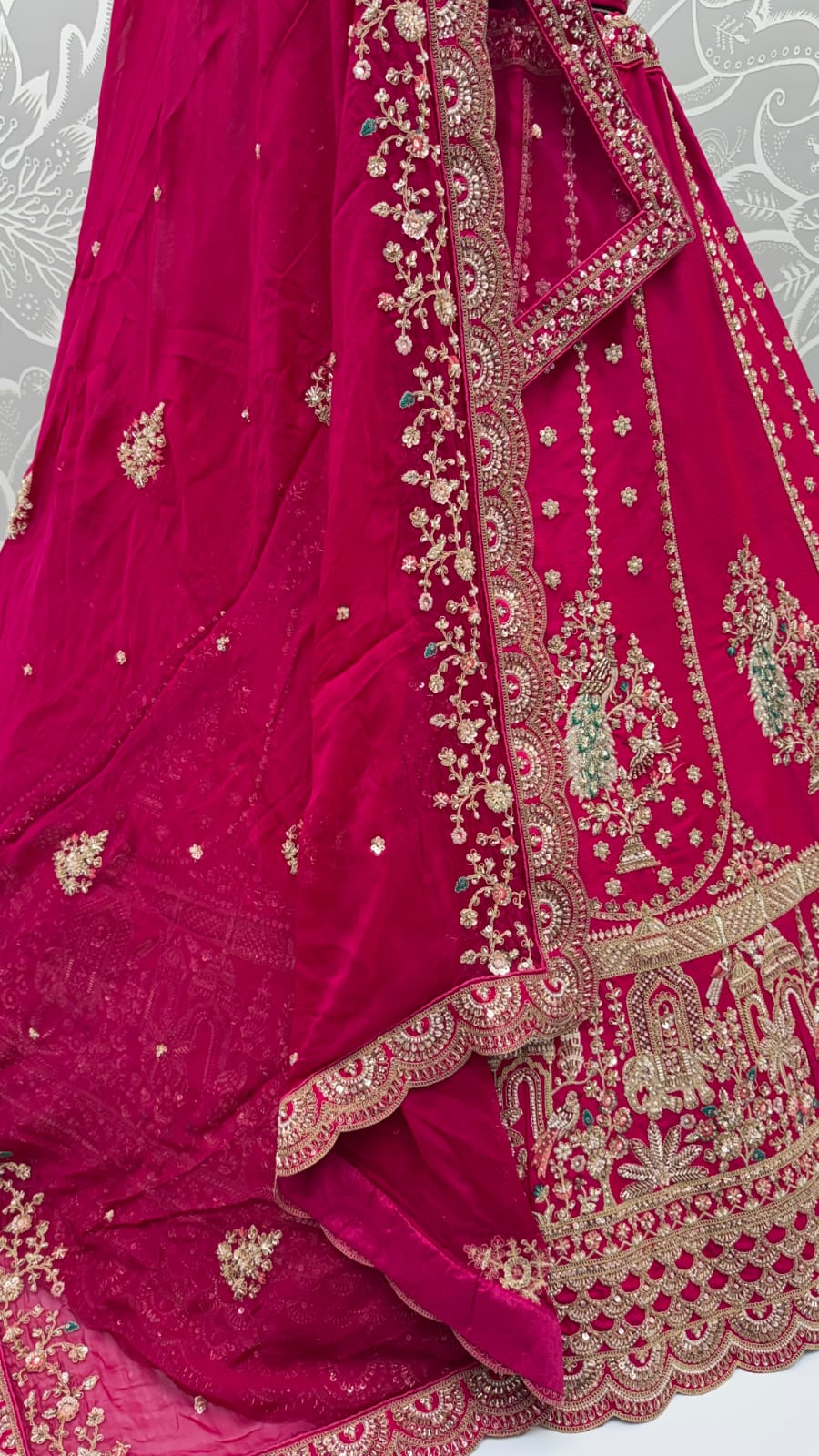 Rani Pink Pure Gadhwal Silk Peacock Pattern Handwork Motif Sequins Work Bridal Lehenga Choli