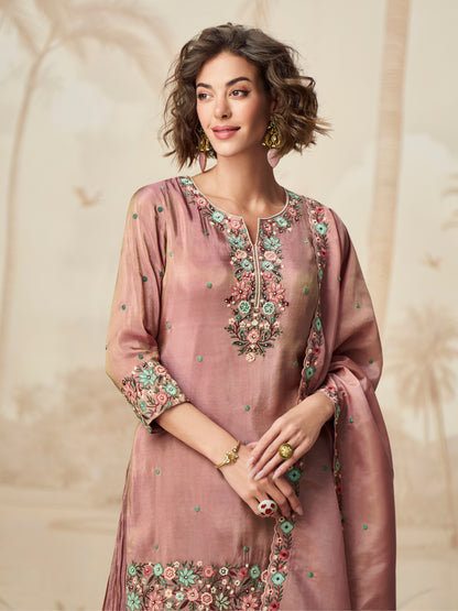 Close-up of floral embroidery on mauve suit

