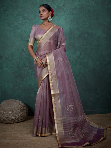 Mauve tissue linen saree with golden lace and tassels