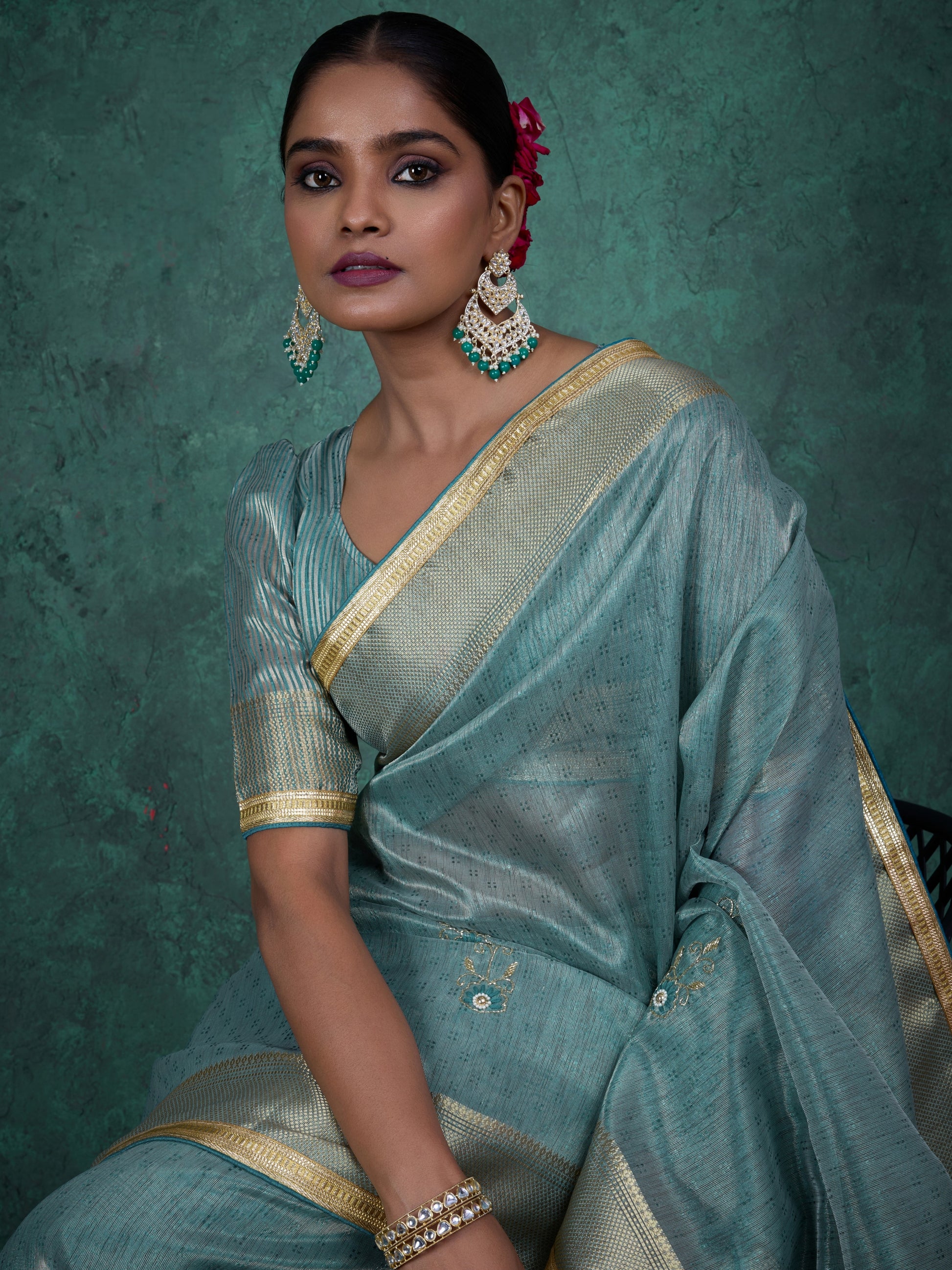 Tissue linen saree in blue with designer tassels