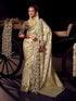 Cream and gold Banarasi saree with maroon contrast heavy embroidered blouse