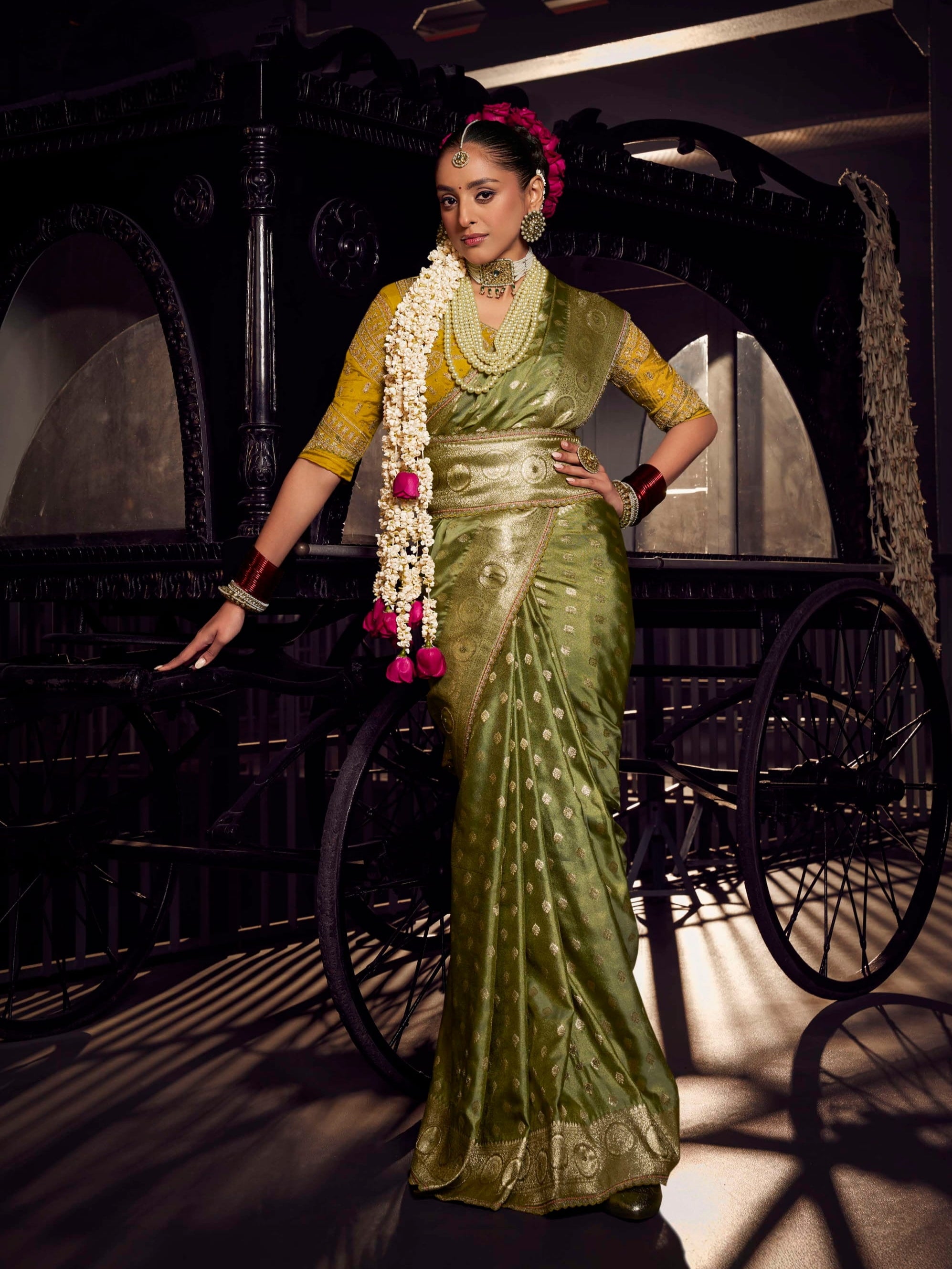 Olive green Banarasi saree with mustard yellow contrast heavy embroidered blouse