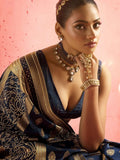 Model wearing blue bridal saree with intricate work