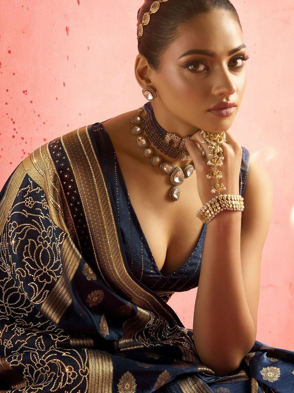 Model wearing blue bridal saree with intricate work
