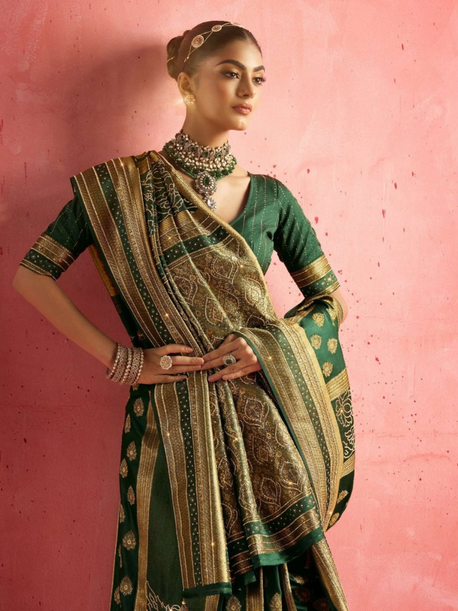 Model wearing green bridal saree with intricate work

