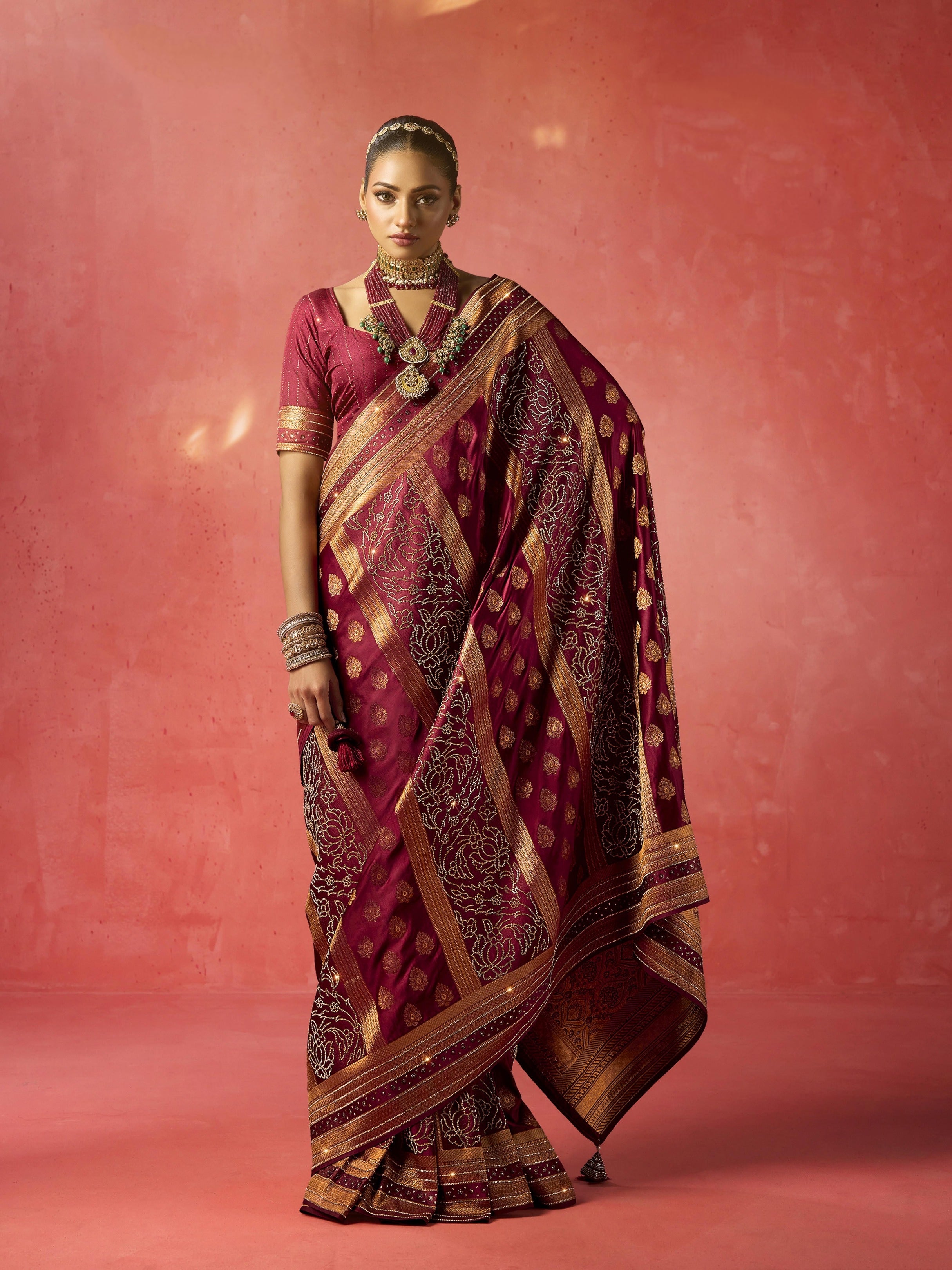 Maroon bridal saree with heavy zircon and Saroski work

