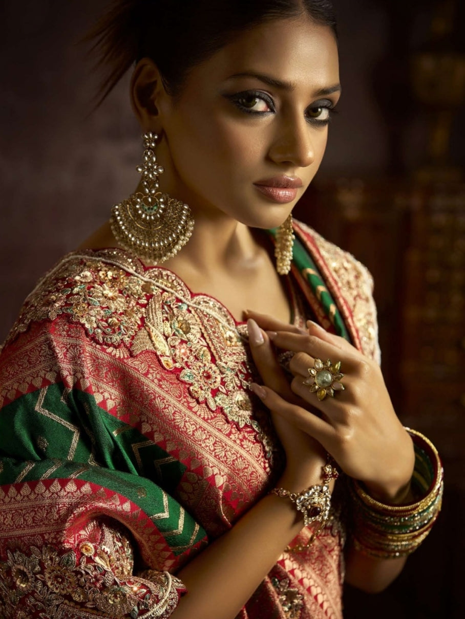 Emerald green bridal saree with peach border

