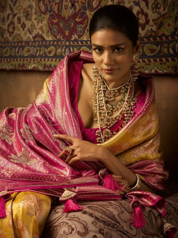 Mustard yellow Kanjivaram saree with pink pallu

