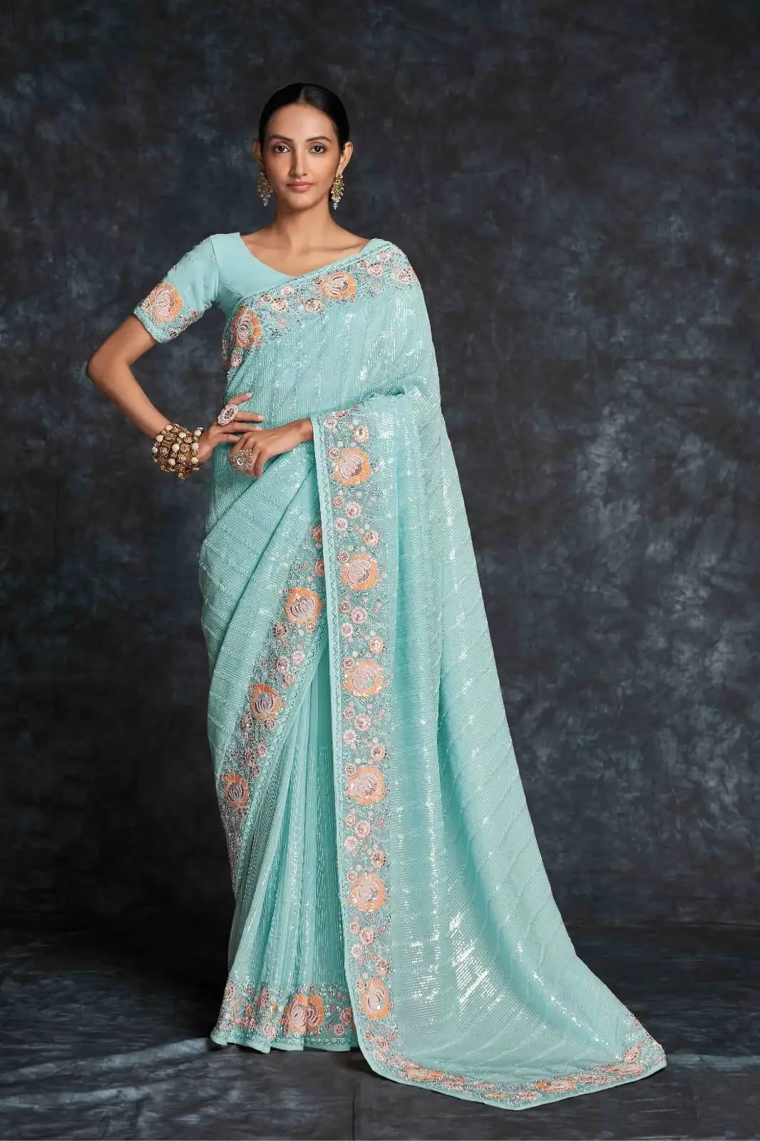 Aqua blue georgette saree with floral embroidery front view

