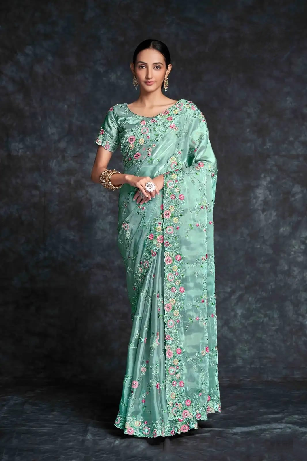 Pista green georgette saree with floral embroidery

